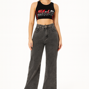 Woman wearing high waist straight loose black casual jeans with a relaxed fit and white sneakers