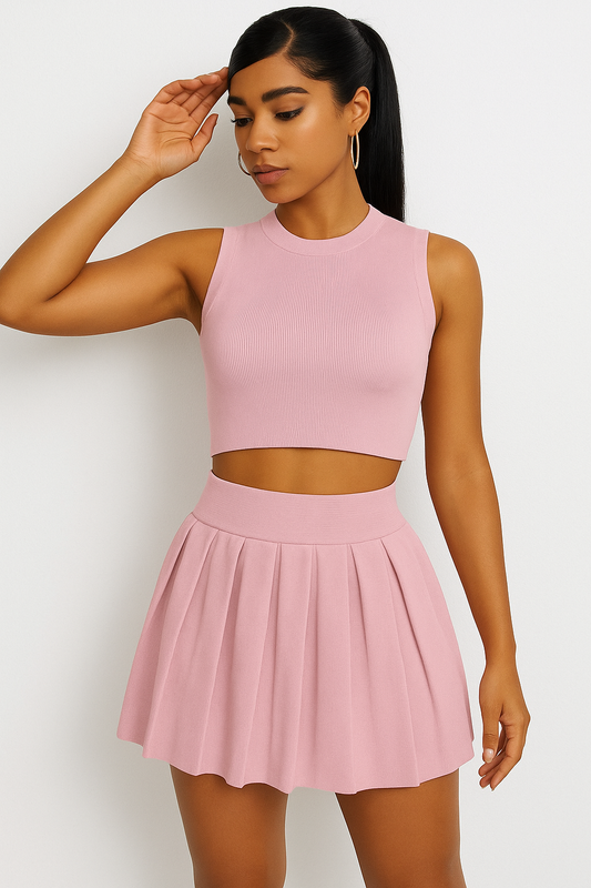 Solid color round neck sleeveless vest and high-rise pleated short skirt set for women.