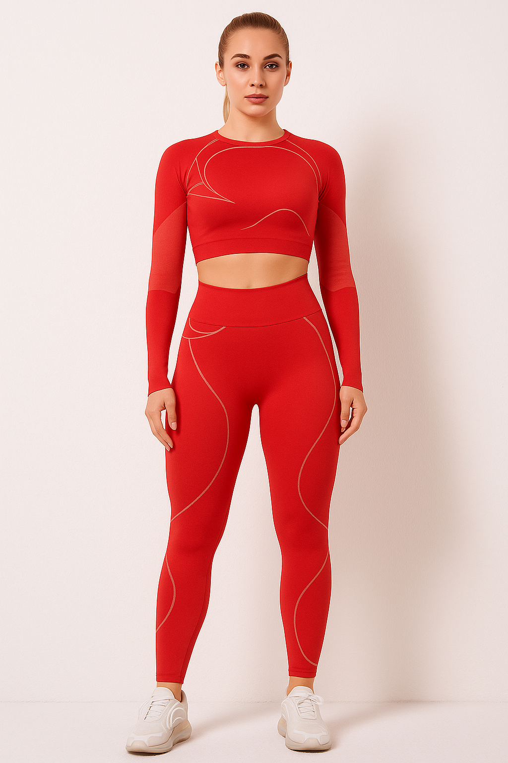 Woman wearing red TrendFlex Fitwear sport suit yoga set with long sleeves and high-waisted leggings, standing against a plain background.